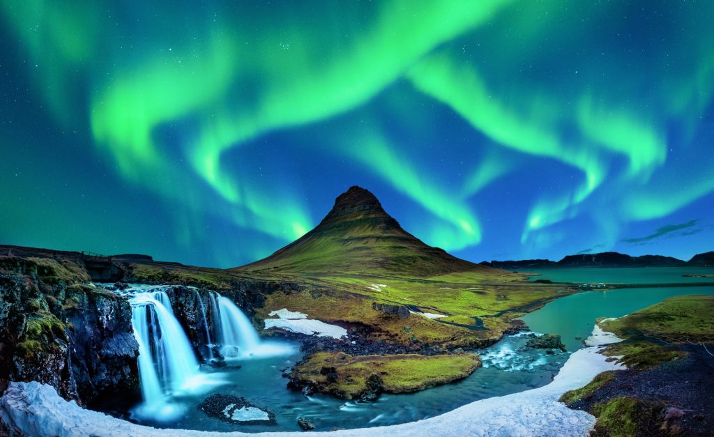 Northern lights above Mount Kirkjufell and its waterfall, Iceland