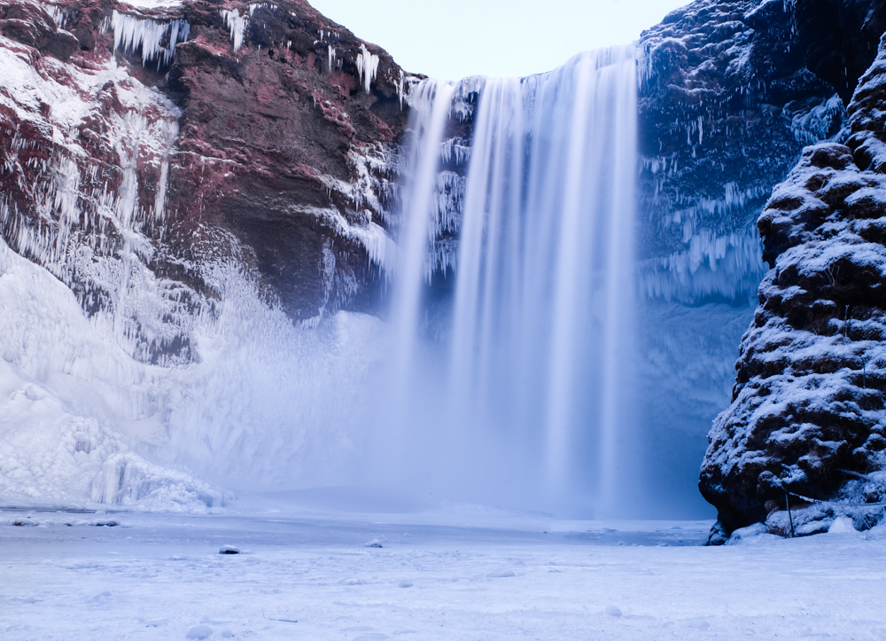 Frozen Skógafoss waterfall in winter, Iceland